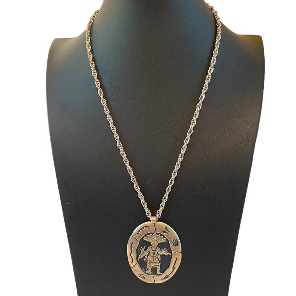 Nickel Silver Southwestern Themed Pendant on Silver Toned Rope Chain.